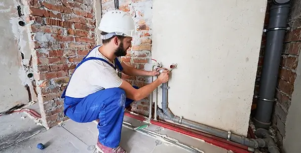 Man installing a pipe