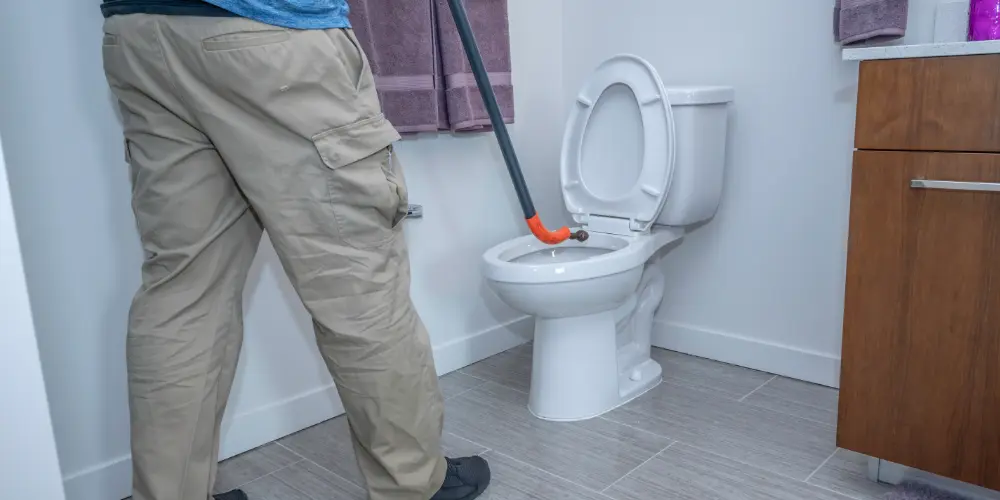 How to Use a Toilet Auger to Clear Stubborn Blockages | Orange Coast ...