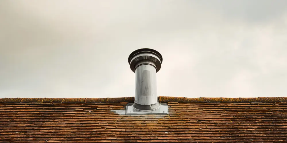 A plumbing vent on a roof